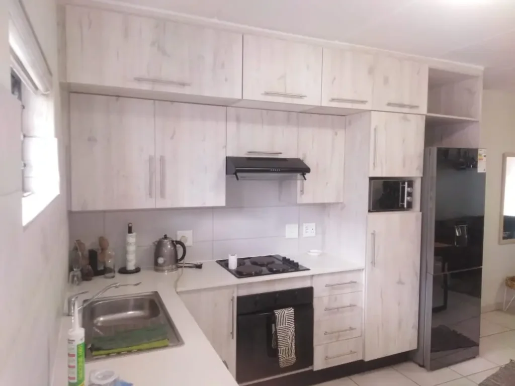 Custom kitchen cupboards and built-in units installed by a carpenter in Kempton Park, showing clean finishes, modern cabinets, and fitted appliances
